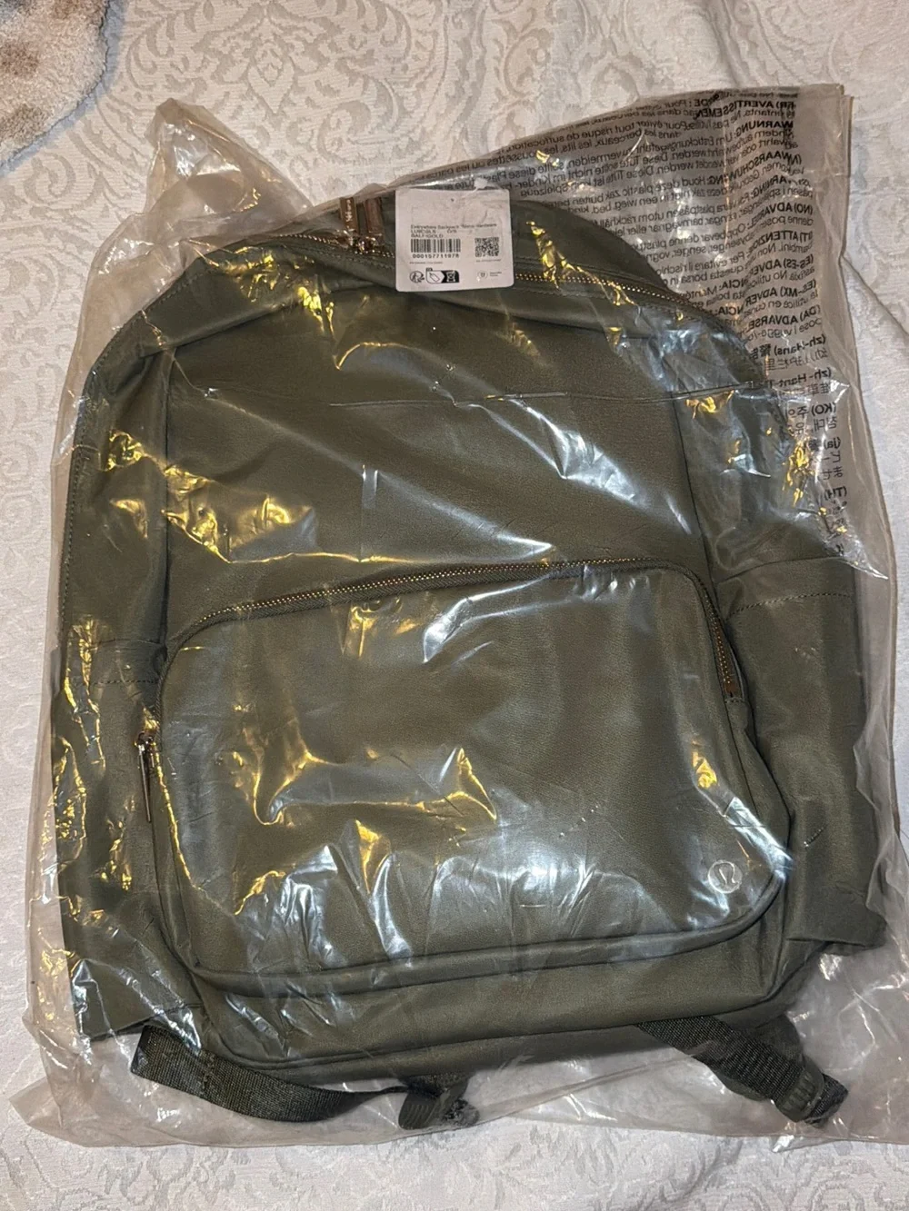 Green everywhere lululemon backpack with gold hardware